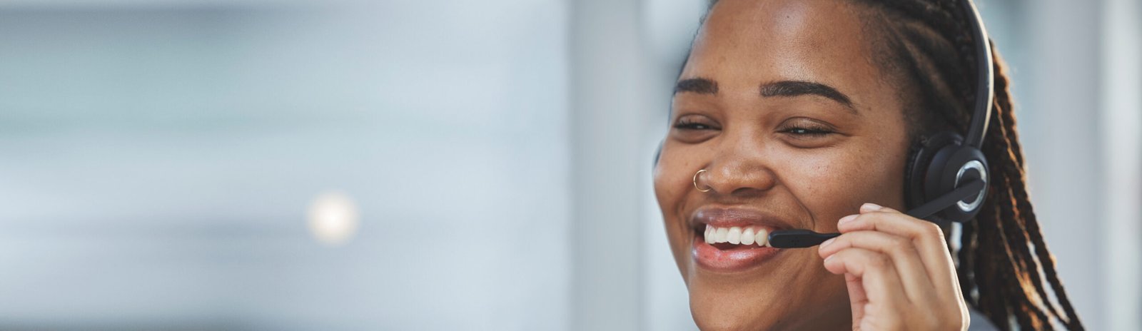 Call center banner, happy and black woman with a headset for consulting, online contact and telemarketing. Ecommerce, mockup and an African customer service worker with a smile for advice and support.